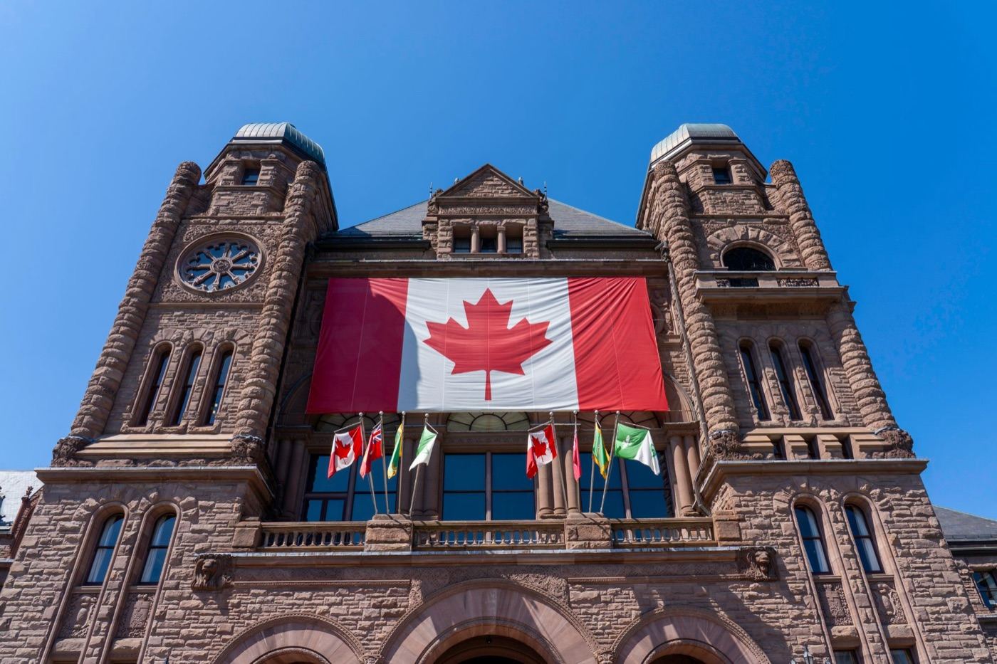 Ontario Legislative Building with the Canadian flag